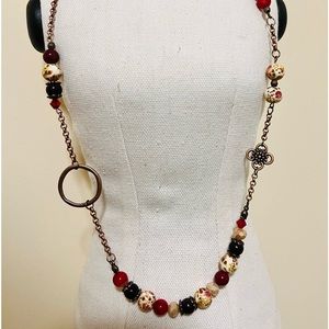 23 inch copper color chain, nickel free.  Glass beads